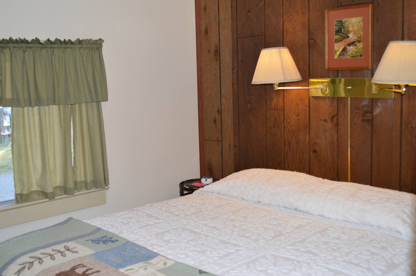 Bedrooms, with queen bed, heated mattress pad, small closet, and chest of drawers.
