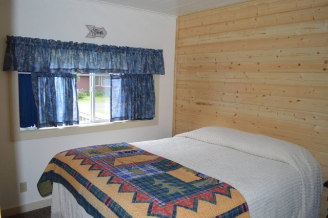 The newly remodeled bedroom includes a queen bed and heated mattress pad.